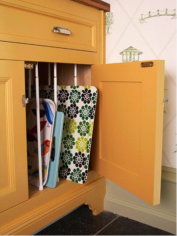 Tension rods can be used vertically to keep cabinet storage neat.