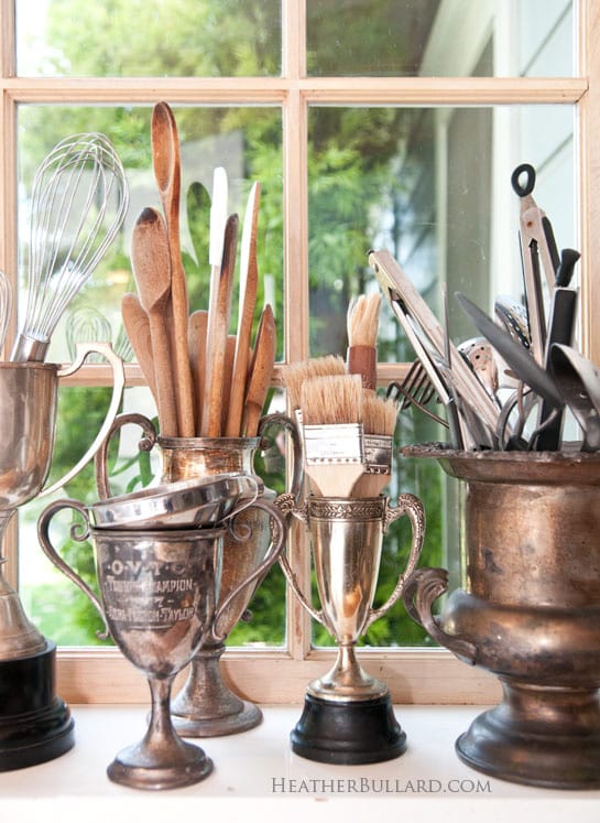 Store utensils in vintage trophies.